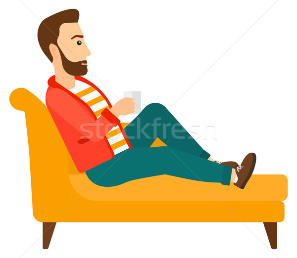 Stock photo: Man lying with cup of tea.