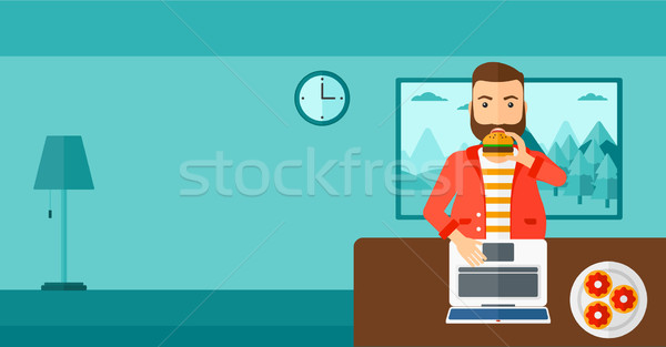 Man eating hamburger.  Stock photo © RAStudio