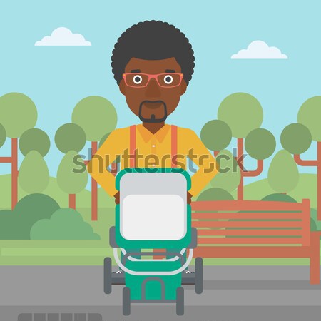 Father walking with baby stroller. Stock photo © RAStudio