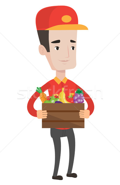 Stock photo: Delivery man delivering groceries to customer.