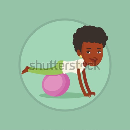 Young woman exercising with fitball. Stock photo © RAStudio