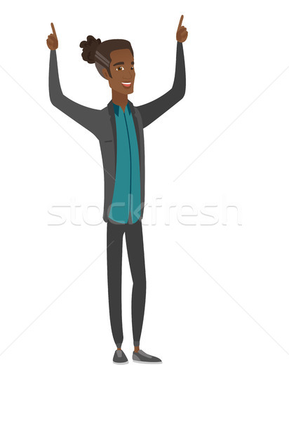 Stock photo: African businessman standing with raised arms up.