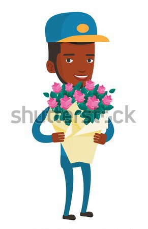 Delivery courier holding bouquet of flowers. Stock photo © RAStudio