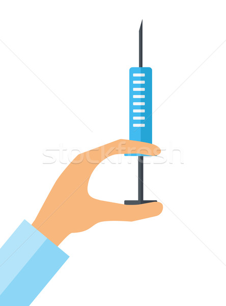 Hypodermic syringe in doctor hand Stock photo © RAStudio