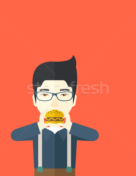Man eating hamburger.  Stock photo © RAStudio