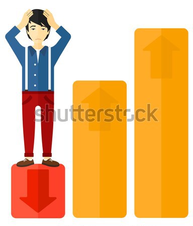 Stock photo: Businessman standing on low graph.