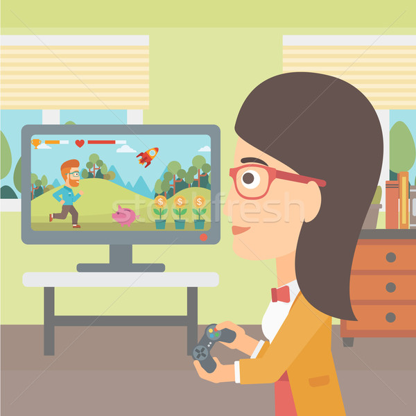 Woman playing video game. Stock photo © RAStudio