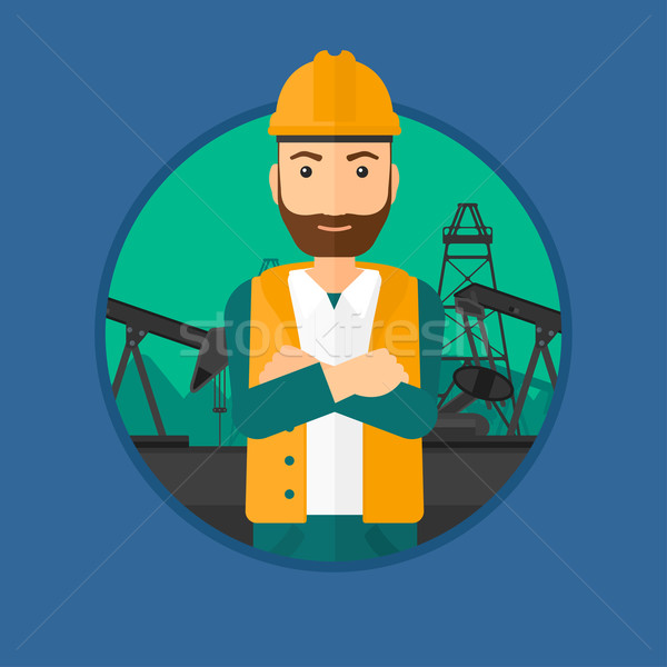 Ölarbeiter Hipster einheitliche Helm stehen Arme Stock foto © RAStudio