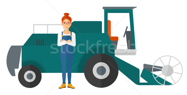 Woman standing with combine on background. Stock photo © RAStudio