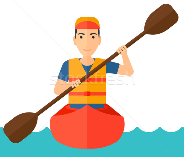 Stock photo: Man riding in canoe.