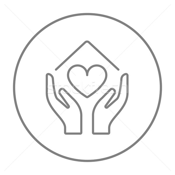 Stock photo: Hands holding house symbol with heart shape line icon.