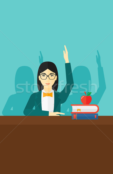 Stock photo: Woman raising her hand.