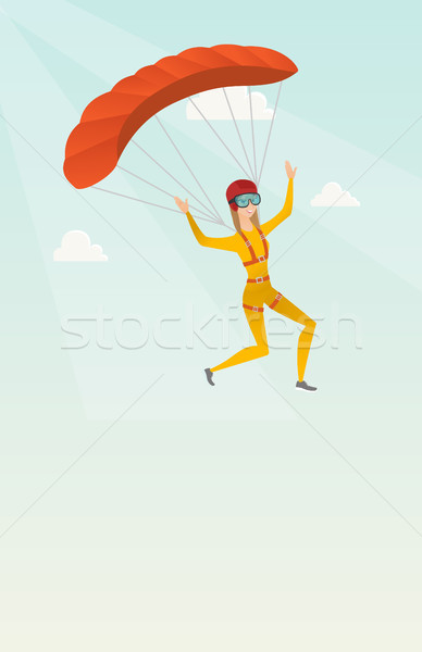 Young caucasian skydiver flying with a parachute. Stock photo © RAStudio