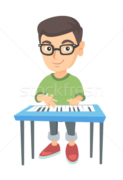 мало кавказский мальчика играет фортепиано Сток-фото © RAStudio
