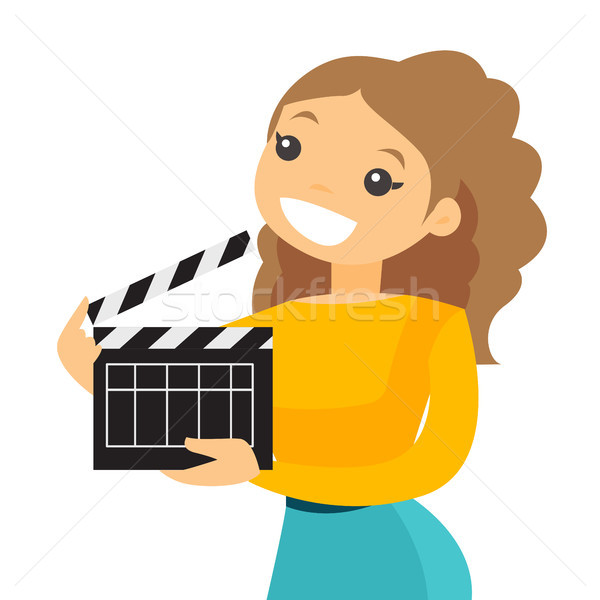 Smiling woman holding an open clapperboard. Stock photo © RAStudio