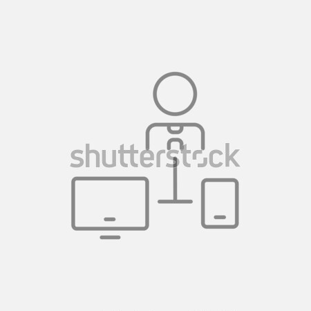 Man linked with computer and phone line icon. Stock photo © RAStudio