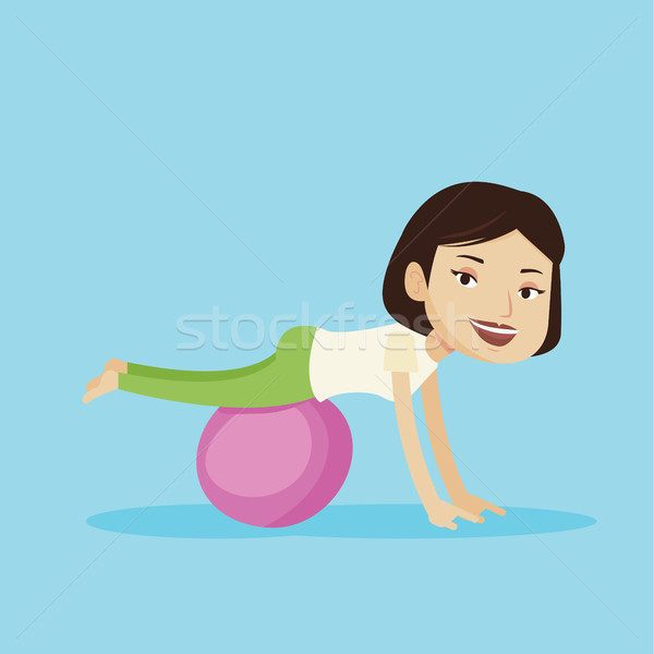 Young woman exercising with fitball. Stock photo © RAStudio