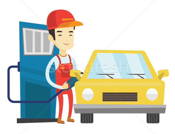 Stock photo: Worker filling up fuel into car at the gas station