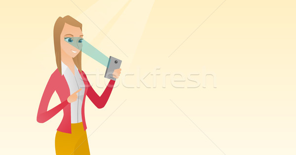 Woman using iris scanner to unlock mobile phone. Stock photo © RAStudio