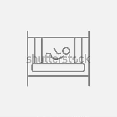 Baby laying in crib line icon. Stock photo © RAStudio