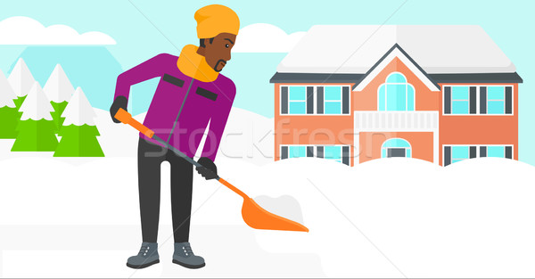 Man shoveling and removing snow. Stock photo © RAStudio