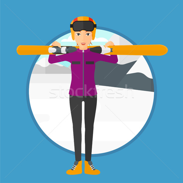 Woman holding skis. Stock photo © RAStudio