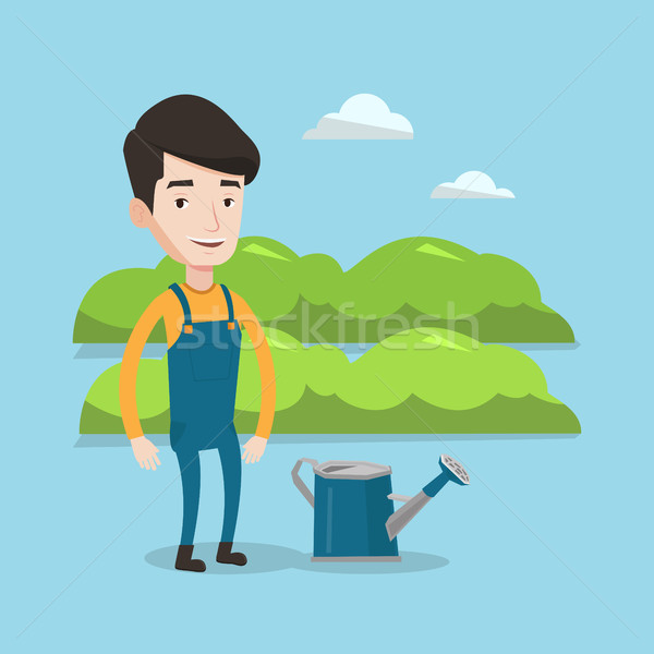 Farmer with watering can at field. Stock photo © RAStudio