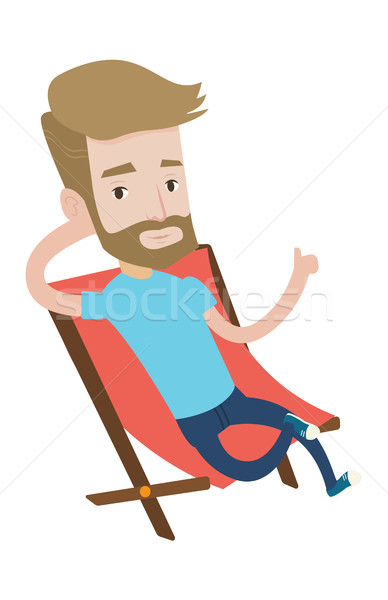 Young tourist sitting in folding chair. Stock photo © RAStudio