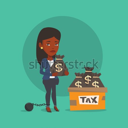 Chained taxpayer with bags full of taxes. Stock photo © RAStudio