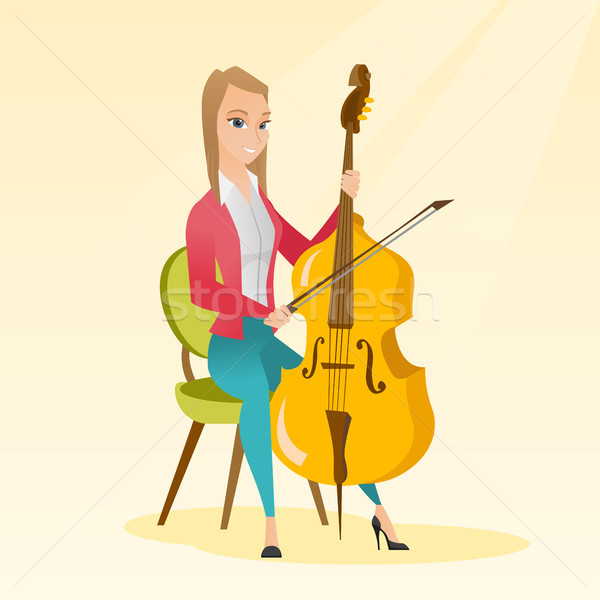 Kobieta gry wiolonczela młodych posiedzenia Zdjęcia stock © RAStudio