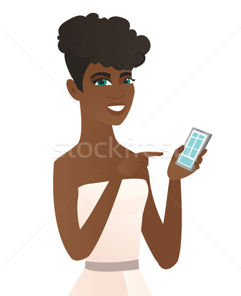 Young african fiancee holding a mobile phone. Stock photo © RAStudio