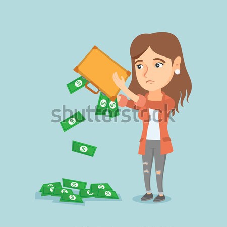 Penniless woman shaking out money from briefcase. Stock photo © RAStudio