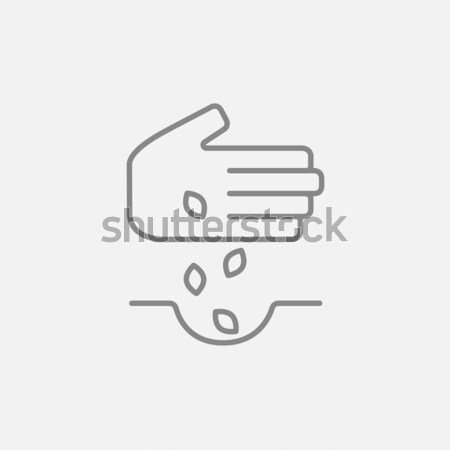 Stock photo: Hand planting seeds in ground line icon.