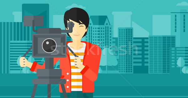 Cameraman with movie camera on a tripod. Stock photo © RAStudio
