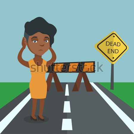 Femme d'affaires regarder panneau routier morts africaine Photo stock © RAStudio