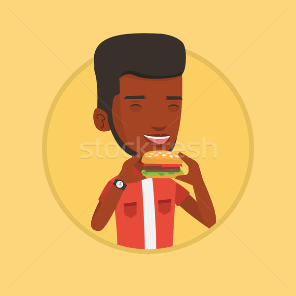 Stockfoto: Man · eten · hamburger · blijde · gelukkig