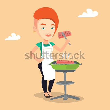 Man cooking steak on barbecue grill. Stock photo © RAStudio