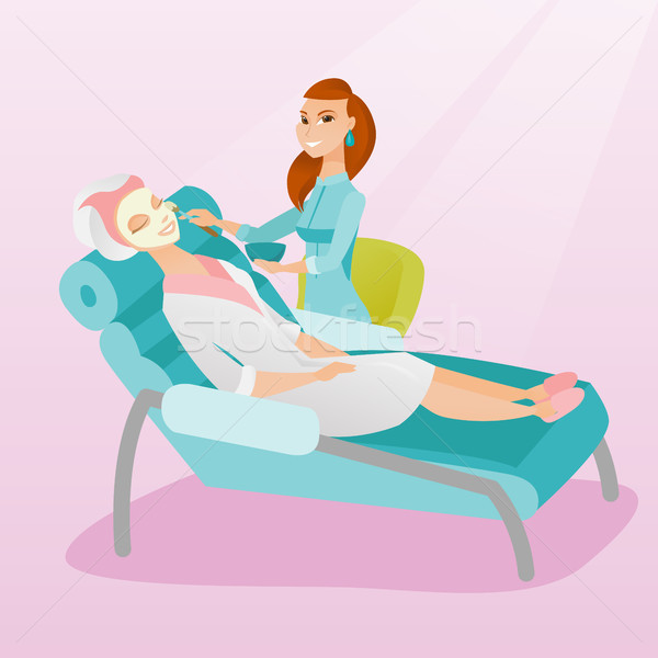 Woman in beauty salon during cosmetology procedure Stock photo © RAStudio