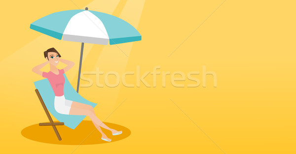 Young caucasian woman relaxing on the beach chair. Stock photo © RAStudio