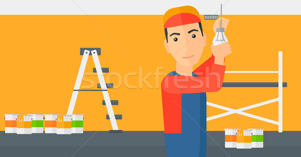 Electrician twisting light bulb. Stock photo © RAStudio