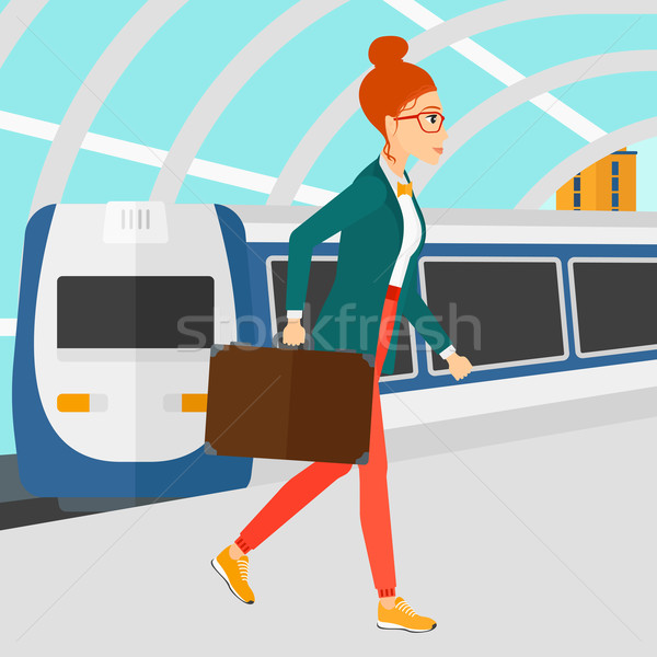 Stock photo: Woman going out of train.