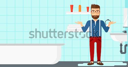 Man in despair standing near leaking sink. Stock photo © RAStudio