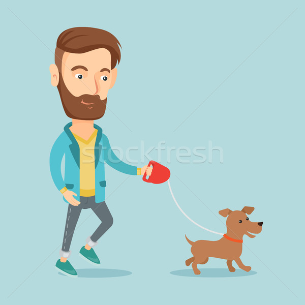 Young man walking with his dog. Stock photo © RAStudio