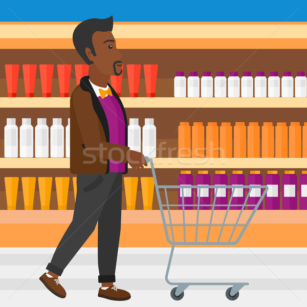 Vásárló férfi toló üres áruház kosár Stock fotó © RAStudio