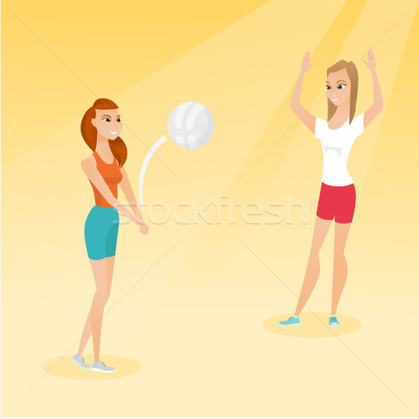 Dois caucasiano mulheres jogar praia voleibol Foto stock © RAStudio