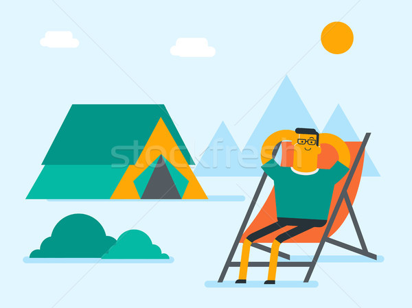 Man sitting in a folding chair in the camping. Stock photo © RAStudio