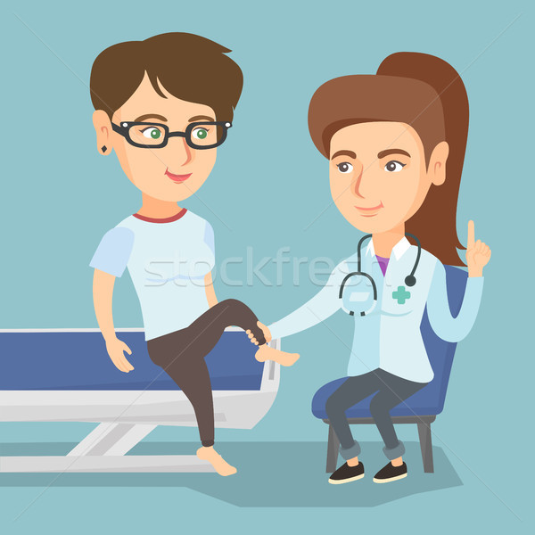 Caucasian gym doctor checking ankle of a patient. Stock photo © RAStudio