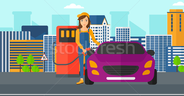 Woman filling up fuel into car. Stock photo © RAStudio