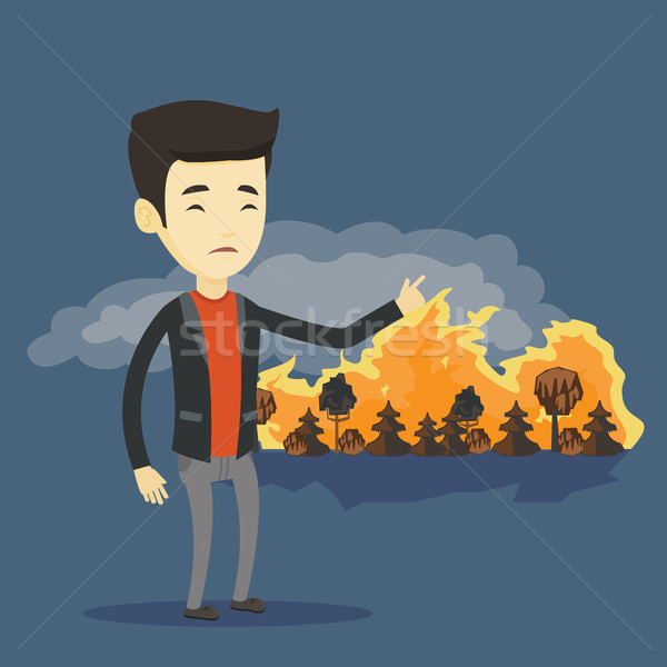 Homme permanent wildfire jeunes asian pointant [[stock_photo]] © RAStudio