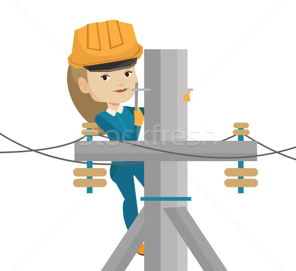 Electrician working on electric power pole. Stock photo © RAStudio